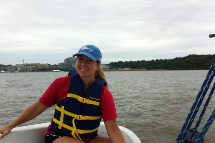 a person sitting in a boat on a body of water