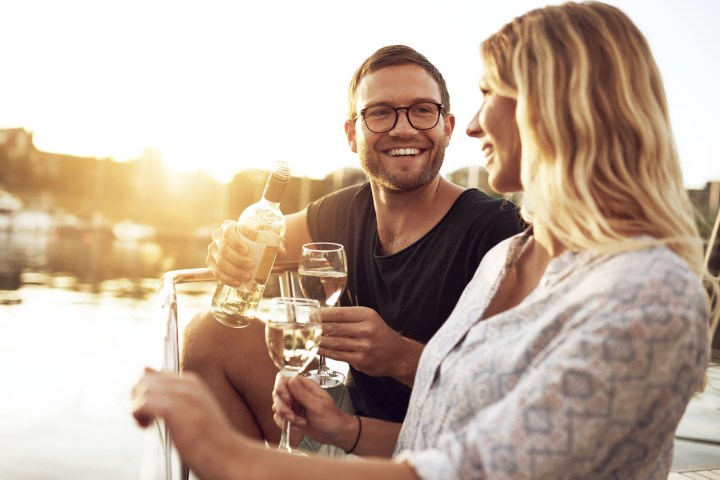 a person holding a glass of wine